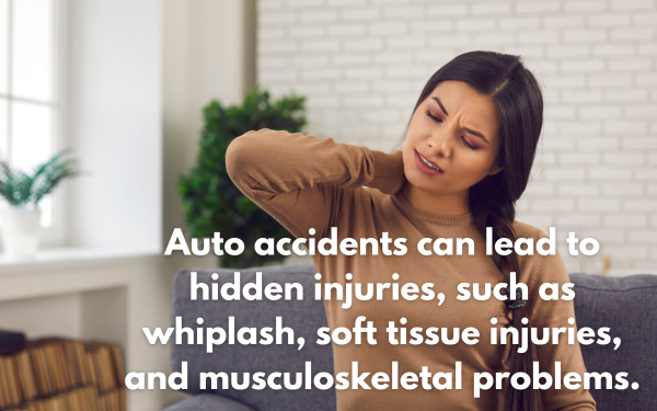 A woman noticing sudden neck pain after an auto accident